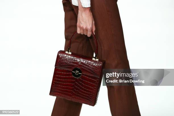 Model, bag detail, walks the runway at the I'Vr Isabel Vollrath show during the Berlin Fashion Week Spring/Summer 2019 at ewerk on July 5, 2018 in...