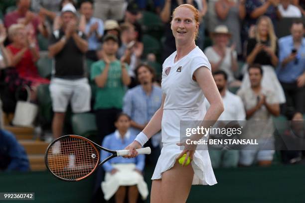 Belgium's Alison Van Uytvanck celebrates winning against Spain's Garbine Muguruza during their women's singles second round match on the fourth day...