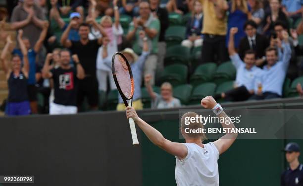 Belgium's Alison Van Uytvanck celebrates winning against Spain's Garbine Muguruza during their women's singles second round match on the fourth day...