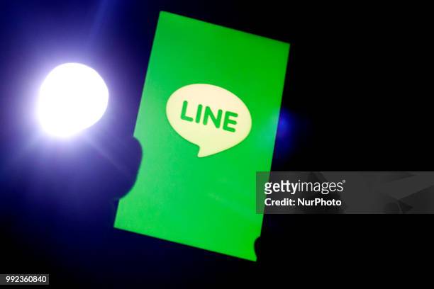 He logo of free messaging app Line is pictured on a smartphone in this photo illustration taken in Tokyo, Japan July 06, 2018.