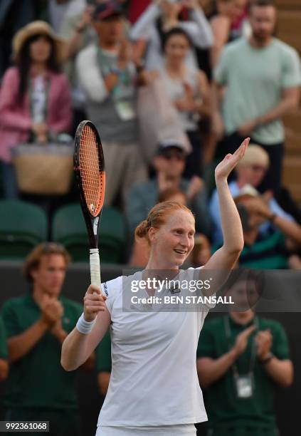 Belgium's Alison Van Uytvanck celebrates winning against Spain's Garbine Muguruza during their women's singles second round match on the fourth day...