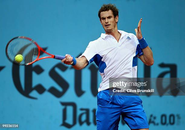 Andy Murray of Great Britain plays a backhand to Victor Hanescu of Romania in their third round match during the Mutua Madrilena Madrid Open tennis...