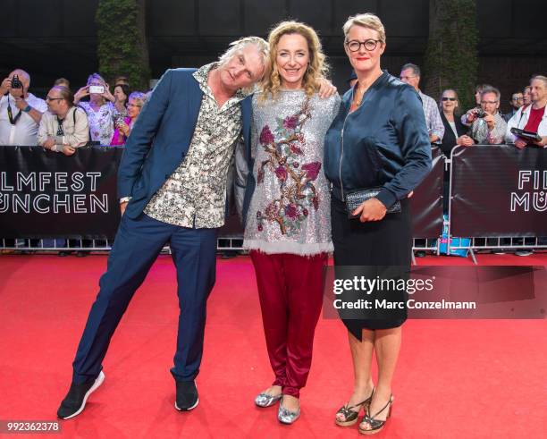 Detlev Buck , Diana Illien and Viola Jaeger are seen at the red carpet before the premiere of the movie 'Asphaltgorillas' as part of the Munich Film...