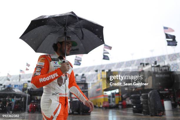 Chase Elliott, driver of the Hooters Chevrolet, walks to his car during practice for the Monster Energy NASCAR Cup Series Coke Zero Sugar 400 at...