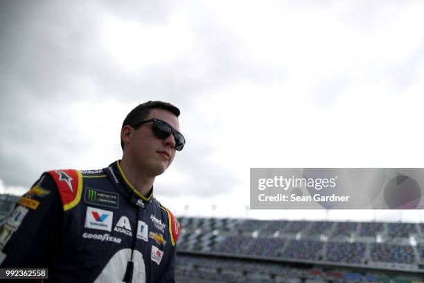 Alex Bowman, driver of the Axalta Chevrolet, walks to his car during practice for the Monster Energy NASCAR Cup Series Coke Zero Sugar 400 at Daytona...