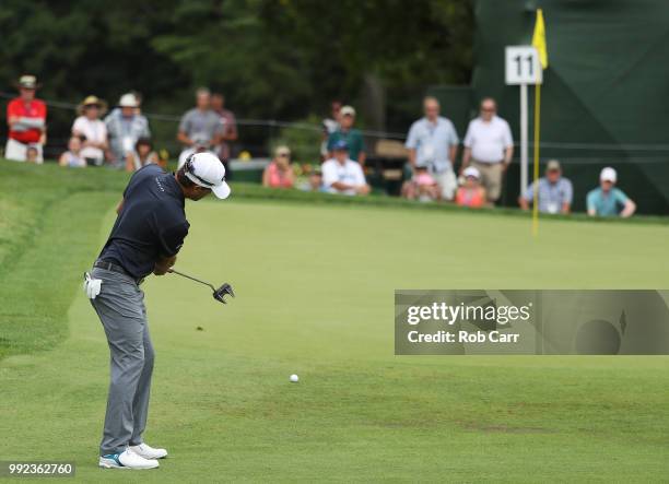 Kevin Kisner takes a long putt on the 11th hole during round one of A Military Tribute At The Greenbrier held at the Old White TPC course on July 5,...