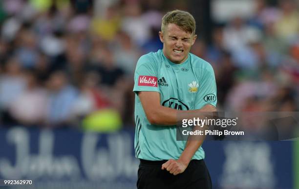 Sam Curran of Surrey reacts during the Vitality T20 Blast match between Middlesex and Surrey at Lord's Cricket Ground on July 5, 2018 in London,...