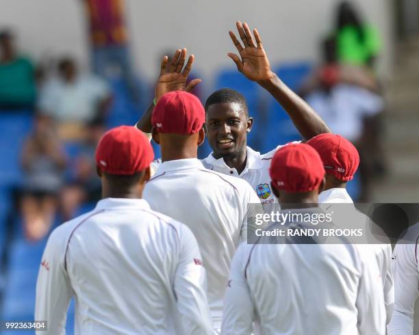 Jason Holder of West Indies celebrates the dismissal of Liton Das of Bangladesh during day 2 of the 1st Test between West Indies and Bangladesh at...