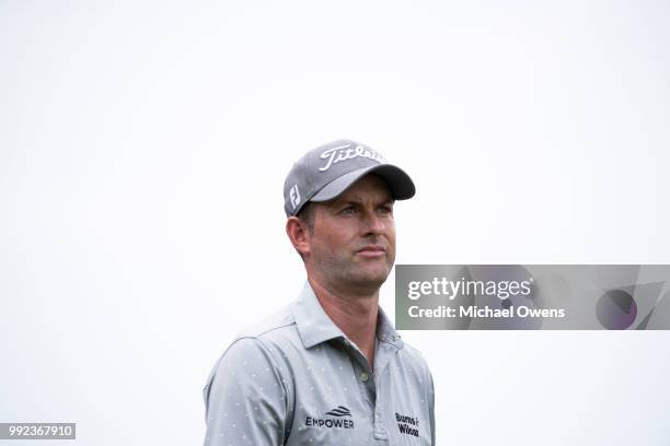 Webb Simpson watches as his group hits of the 12th hole during round one of A Military Tribute At The Greenbrier held at the Old White TPC course on...