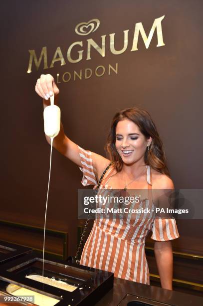 Binky Felstead makes her own personalised Magnum ice cream at the Magnum Pleasure Store launch in Chelsea London, which is has opened for the summer.