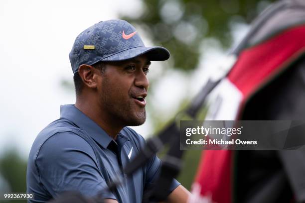 Tony Finau walks to his second shot on the 12th hole during round one of A Military Tribute At The Greenbrier held at the Old White TPC course on...