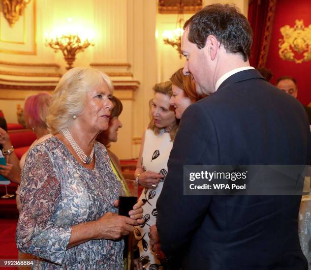 Camilla, Duchess of Cornwall speaks to Editor of the London Evening Standard George Osborne, as she attends a reception celebrating the 50th...