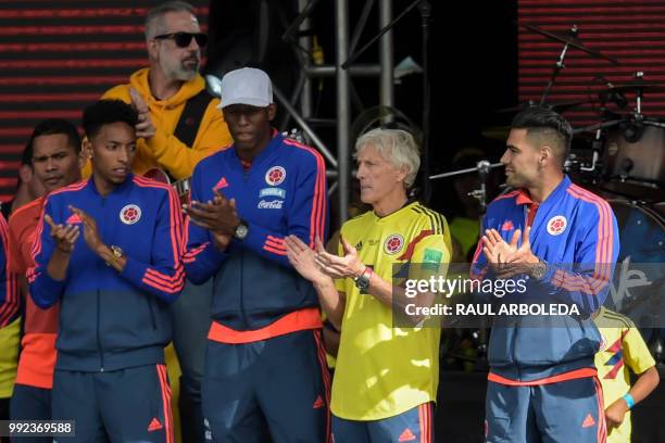 Colombian national team coach Jose Pekerman and players Carlos Bacca , Johan Mojica , Yerry Mina and Radamel Falcao, applaud during their welcoming...