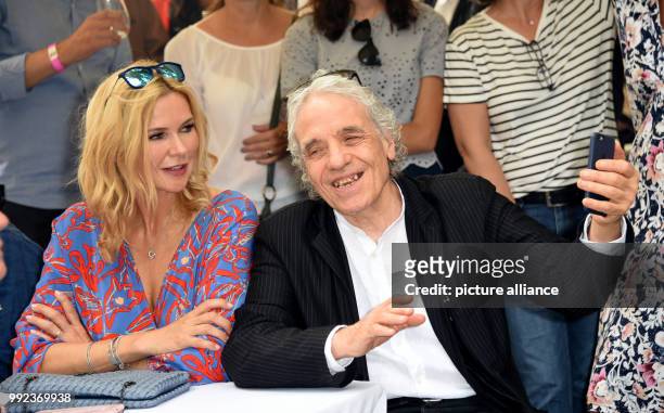 July 2018, Germany, Munich: Actress Veronica Ferres and US director Abel Ferrara at the FFF reception during the Filmfest Munich. Photo: Ursula...
