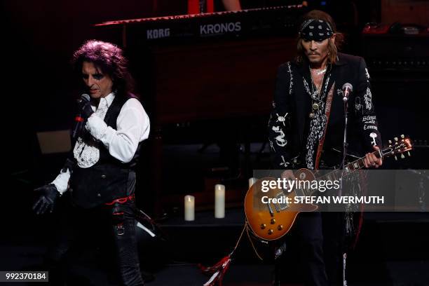 Actor Johnny Depp and singer Alice Cooper perform with The Hollywood Vampires band during the 52th Montreux Jazz Festival on July 5, 2018 in Montreux.