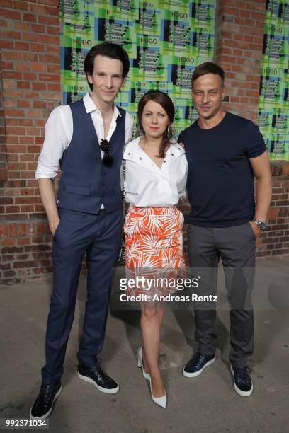 Sabin Tambrea, Alice Dwyer and Tom Wlaschiha attend the HUGO show during the Berlin Fashion Week Spring/Summer 2019 at Motorwerk on July 5, 2018 in...