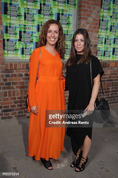 Ulrike Fleischer and guest attend the HUGO show during the Berlin Fashion Week Spring/Summer 2019 at Motorwerk on July 5, 2018 in Berlin, Germany.