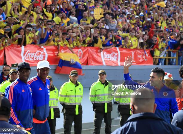 Radamel Falcao , Yerry Mina and Cristian Zapata of Colombia greet the fans as they gather to welcome Colombian National Soccer Team with a welcoming...