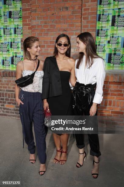 Lisa-Marie Koroll, Nilam Farooq and Luise Befort attend the HUGO show during the Berlin Fashion Week Spring/Summer 2019 at Motorwerk on July 5, 2018...