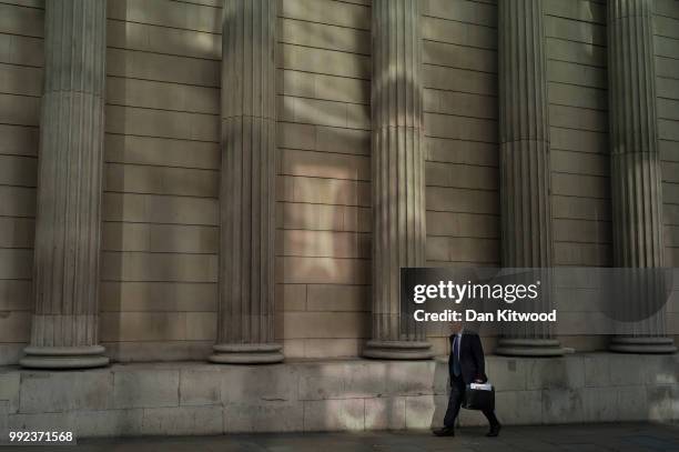 Man walks past The Bank of England on July 5, 2018 in London, England. A prolonged heatwave continues to grip much of the country, with no rain...