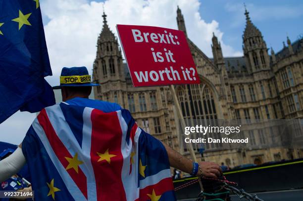 Man protests against Brexit outside the Houses of Parliament on July 5, 2018 in London, England. A prolonged heatwave continues to grip much of the...