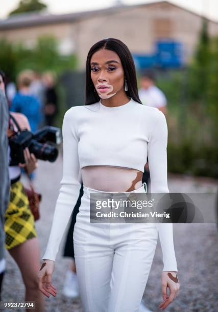 Winnie Harlow wearing white cropped top, white pants is seen at HUGO during the Berlin Fashion Week July 2018 on July 5, 2018 in Berlin, Germany.