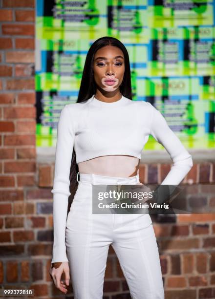 Winnie Harlow wearing white cropped top, white pants is seen at HUGO during the Berlin Fashion Week July 2018 on July 5, 2018 in Berlin, Germany.