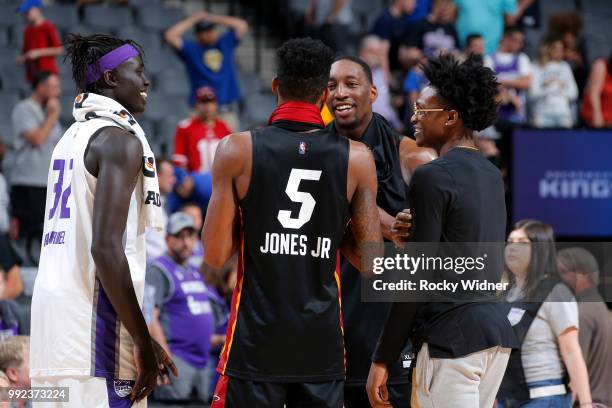 Kenyan Gabriel and De'Aaron Fox of the Sacramento Kings speak with Derrick Jones Jr, Bam Adebayo of the Miami Heat during the 2018 Summer League at...