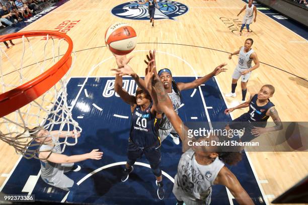 Kayla Alexander of the Indiana Fever shoots the ball against Rebekkah Brunson and Sylvia Fowles of the Minnesota Lynx on July 3, 2018 at Target...