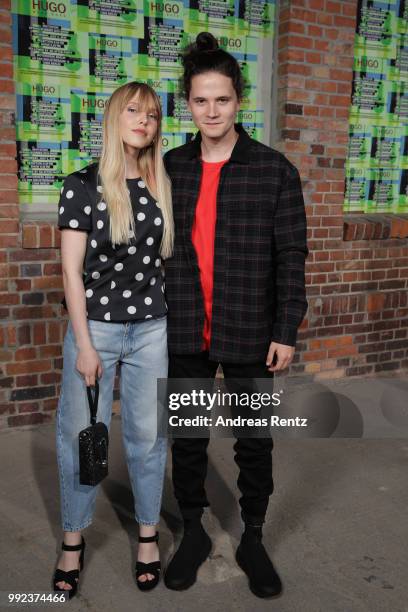 Lina Larissa Strahl and Tilman Poerzgen attend the HUGO show during the Berlin Fashion Week Spring/Summer 2019 at Motorwerk on July 5, 2018 in...