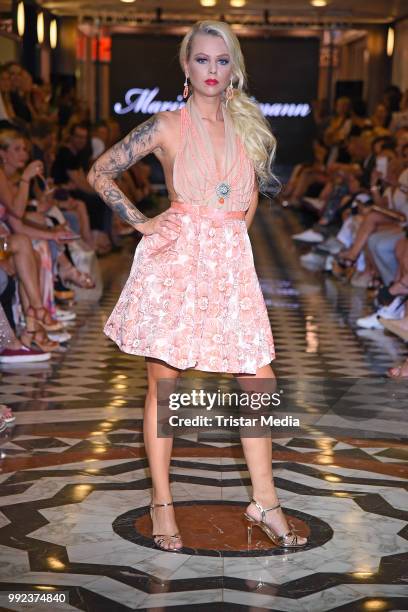 Doreen Steinert walks the runway at the Fashion2Show show during the Berlin Fashion Week Spring/Summer 2019 at Quartier 206 on July 5, 2018 in...