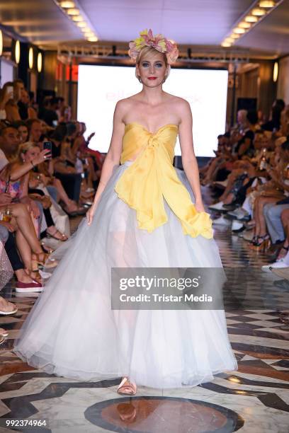 Nina Meise walks the runway at the Fashion2Show show during the Berlin Fashion Week Spring/Summer 2019 at Quartier 206 on July 5, 2018 in Berlin,...