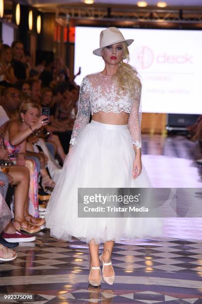 Doreen Steinert walks the runway at the Fashion2Show show during the Berlin Fashion Week Spring/Summer 2019 at Quartier 206 on July 5, 2018 in...