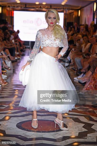 Doreen Steinert walks the runway at the Fashion2Show show during the Berlin Fashion Week Spring/Summer 2019 at Quartier 206 on July 5, 2018 in...