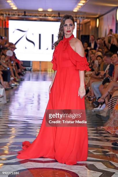 Daniela Dany Michalski walks the runway at the Fashion2Show show during the Berlin Fashion Week Spring/Summer 2019 at Quartier 206 on July 5, 2018 in...