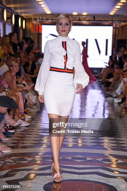 Julia Meise walks the runway at the Fashion2Show show during the Berlin Fashion Week Spring/Summer 2019 at Quartier 206 on July 5, 2018 in Berlin,...