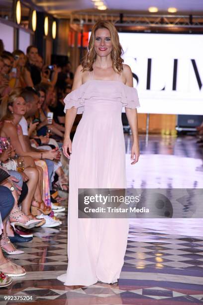 Miriam Lange walks the runway at the Fashion2Show show during the Berlin Fashion Week Spring/Summer 2019 at Quartier 206 on July 5, 2018 in Berlin,...