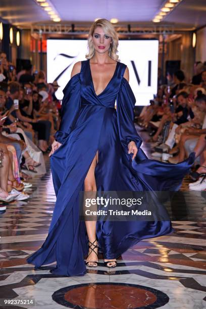 Annika Gassner walks the runway at the Fashion2Show show during the Berlin Fashion Week Spring/Summer 2019 at Quartier 206 on July 5, 2018 in Berlin,...