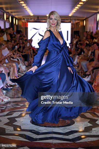 Annika Gassner walks the runway at the Fashion2Show show during the Berlin Fashion Week Spring/Summer 2019 at Quartier 206 on July 5, 2018 in Berlin,...