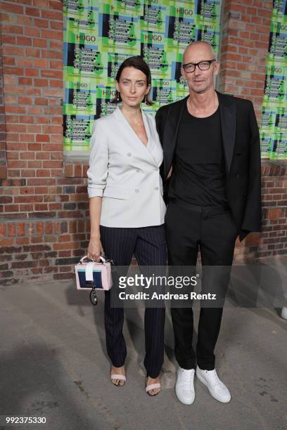 Eva Padberg and Ingo Wilts, Chief Brand Officer HUGO BOSS attend the HUGO show during the Berlin Fashion Week Spring/Summer 2019 at Motorwerk on July...