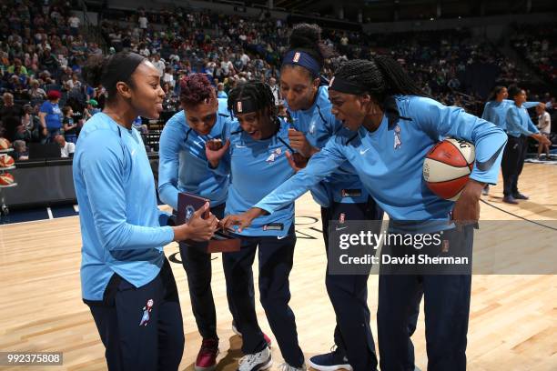 Renee Montgomery of the Atlanta Dream received her 2017 WNBA Championship ring and shares it with her teammates before the game against the Minnesota...