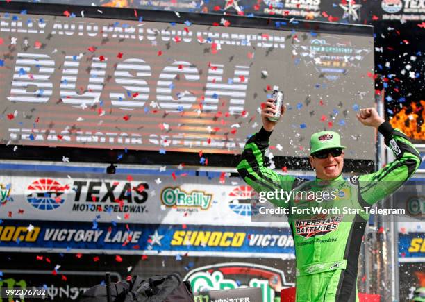 Kyle Busch celebrates his win at the O'Reilly Auto Parts 500 at Texas Motor Speedway on April 8 in Fort Worth, Texas.