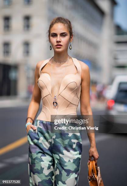 Model Elena Carriere wearing pants with camouflage print is seen outside Marina Hoermanseder during the Berlin Fashion Week July 2018 on July 5, 2018...