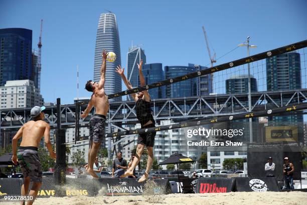 Branden Clemens tries to hit the ball around David Lee during Day 1 of the AVP San Francisco Open at Pier 30-32 on July 5, 2018 in San Francisco,...