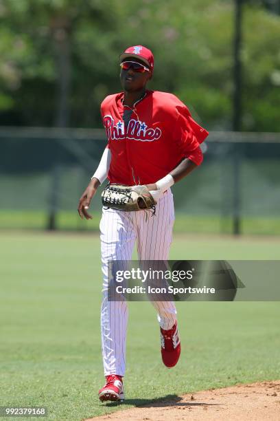 Clearwater, FL Carlos De La Cruz of the Phillies trots back to the dugout between innings during the Gulf Coast League game between the GCL Braves...