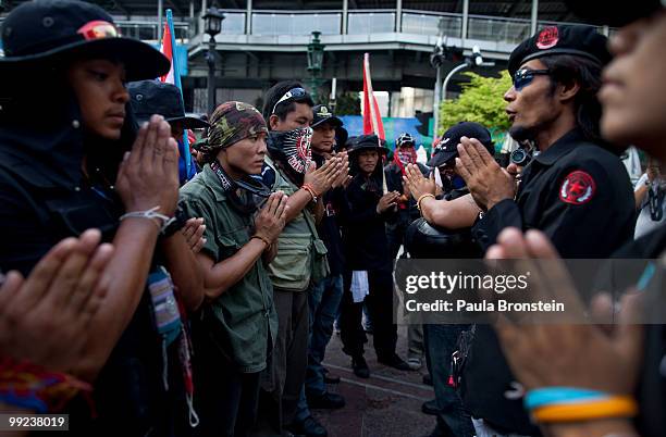 Anti-government Black Shirt Guards pray at a shrine on May 13, 2010 in central Bangkok, Thailand. The Black Shirt Guards are used as security forces...