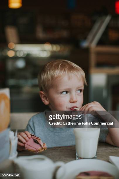 boy drinking milk - drinking milk stock pictures, royalty-free photos & images