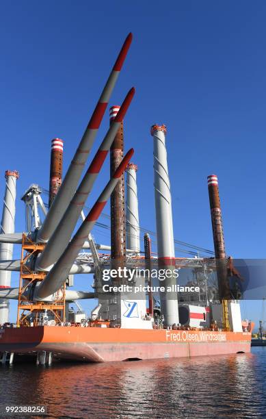 The jack-up vessel 'Brave Fern' is being loaded with components for the Baltic Sea wind farm Iberdrola 'Winkinger' at the harbour of Mukran, Germany,...