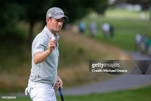 Webb Simpson reacts to the crowd after a birdie putt on the 14th hole during round one of A Military Tribute At The Greenbrier held at the Old White...