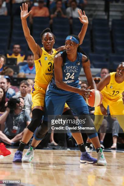 Sylvia Fowles of the Minnesota Lynx handles the ball against Nneka Ogwumike of the Los Angeles Sparks on July 5, 2018 at Target Center in...